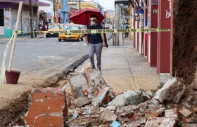 a_woman_walks_by_debris_from_a_building_damaged_by_the_earthquake_in_oaxaca_mexico.jpeg (87.4 KB)