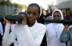  religious_sisters_carrying_a_cross_in_durban_south_africa.jpeg