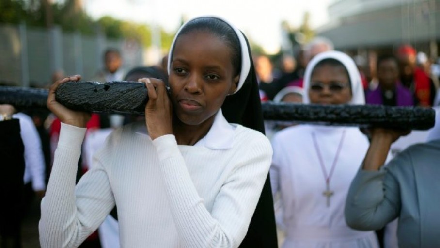  religious_sisters_carrying_a_cross_in_durban_south_africa.jpeg